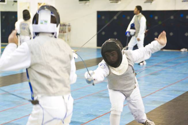 Students at the Fencing Academy of Nevada practice Thursday, Aug. 2, 2012.
